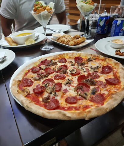 بيتزارو ريستورانت إيتاليانو - الشارقة - +971 600 520000